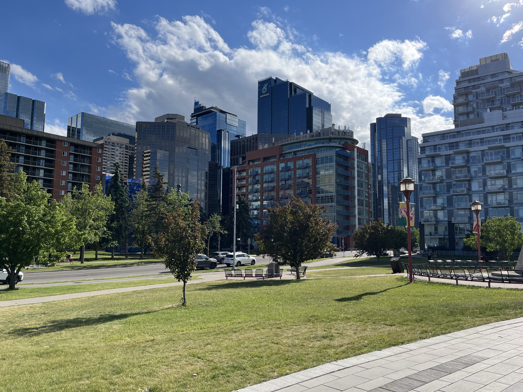 The Calgary skyline beside a green downtown riverside park