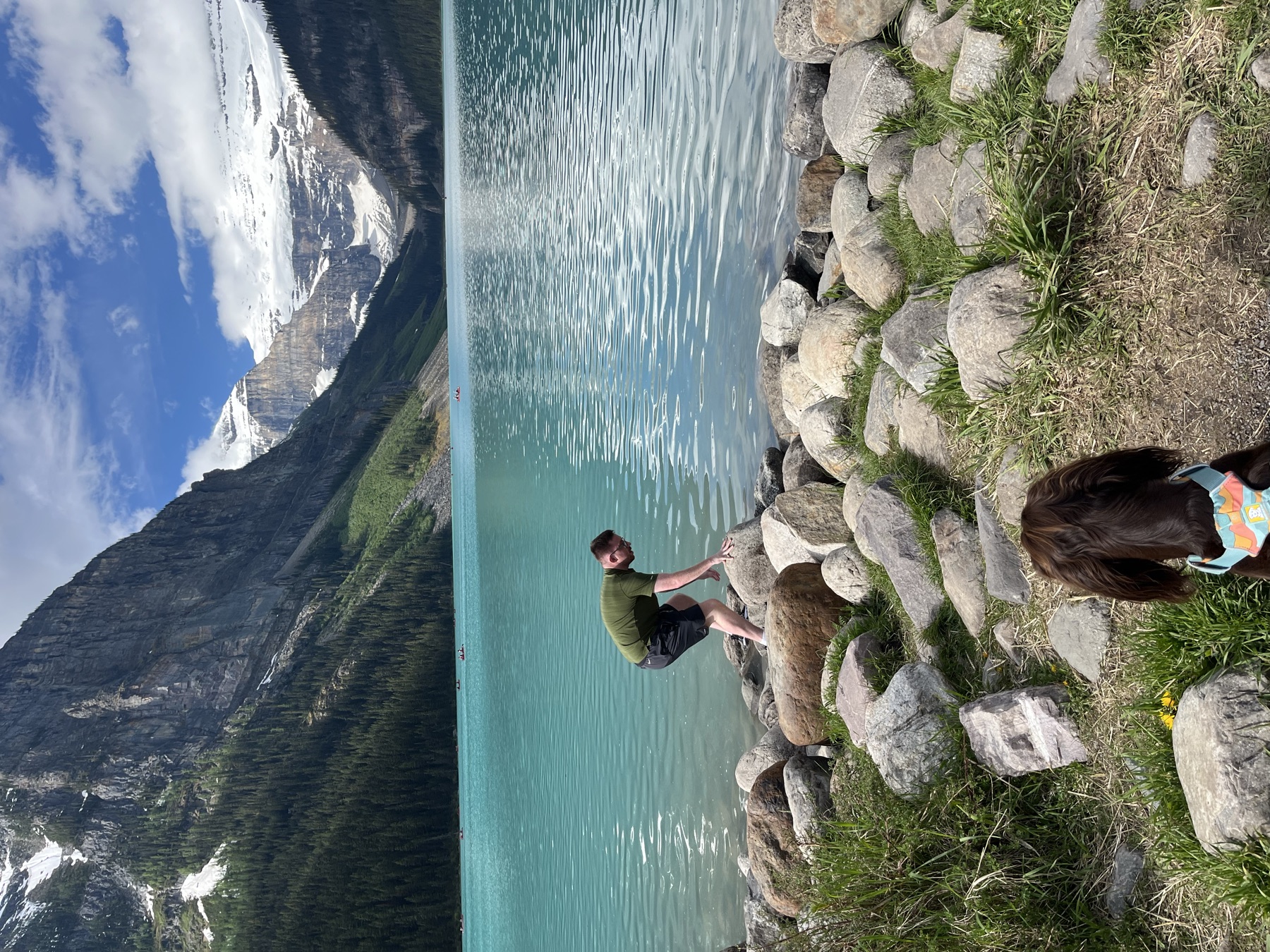 Tilly watching my brother beside Lake Louise