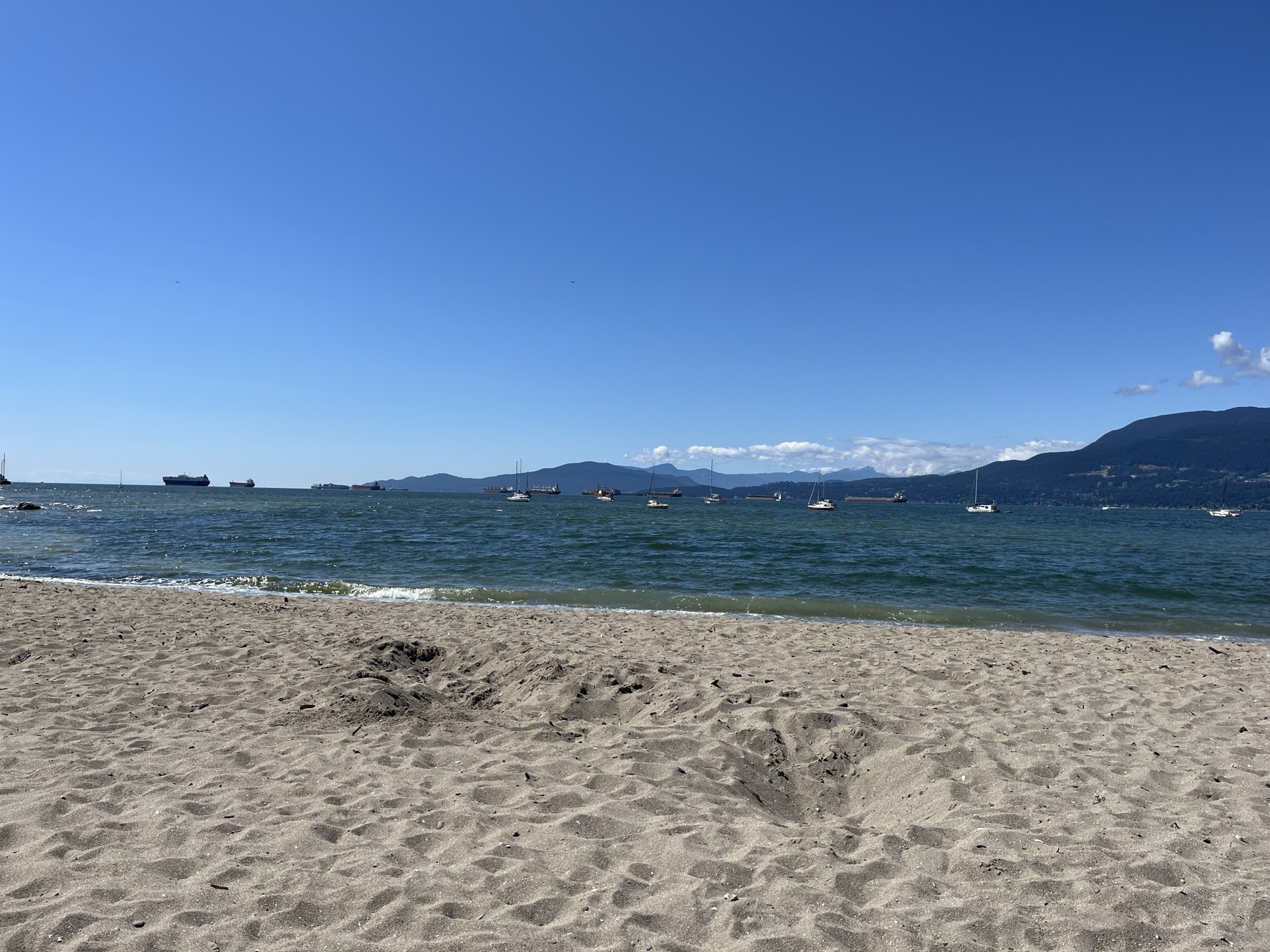 Sand, sailboats and mountains viewed from Hadden Beach