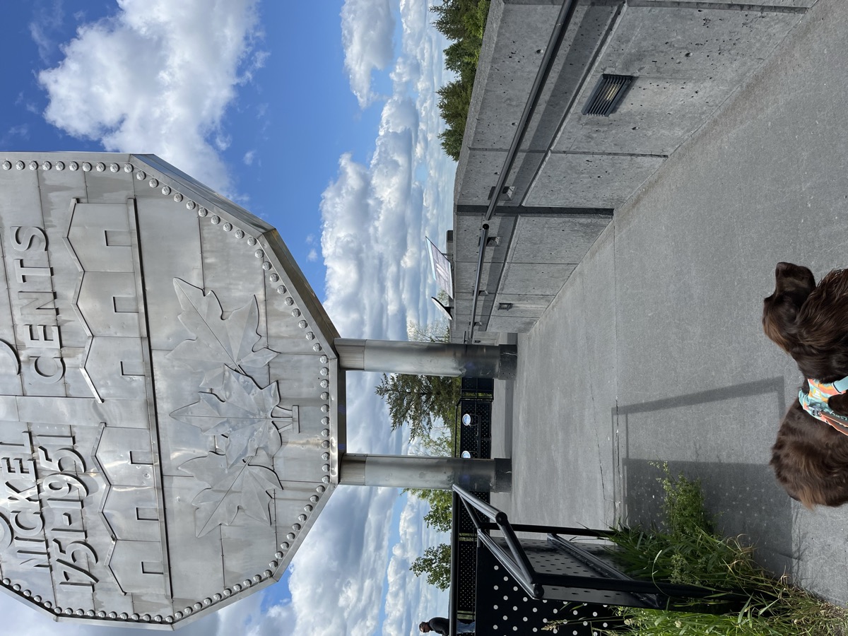Tilly standing below the Big Nickel
