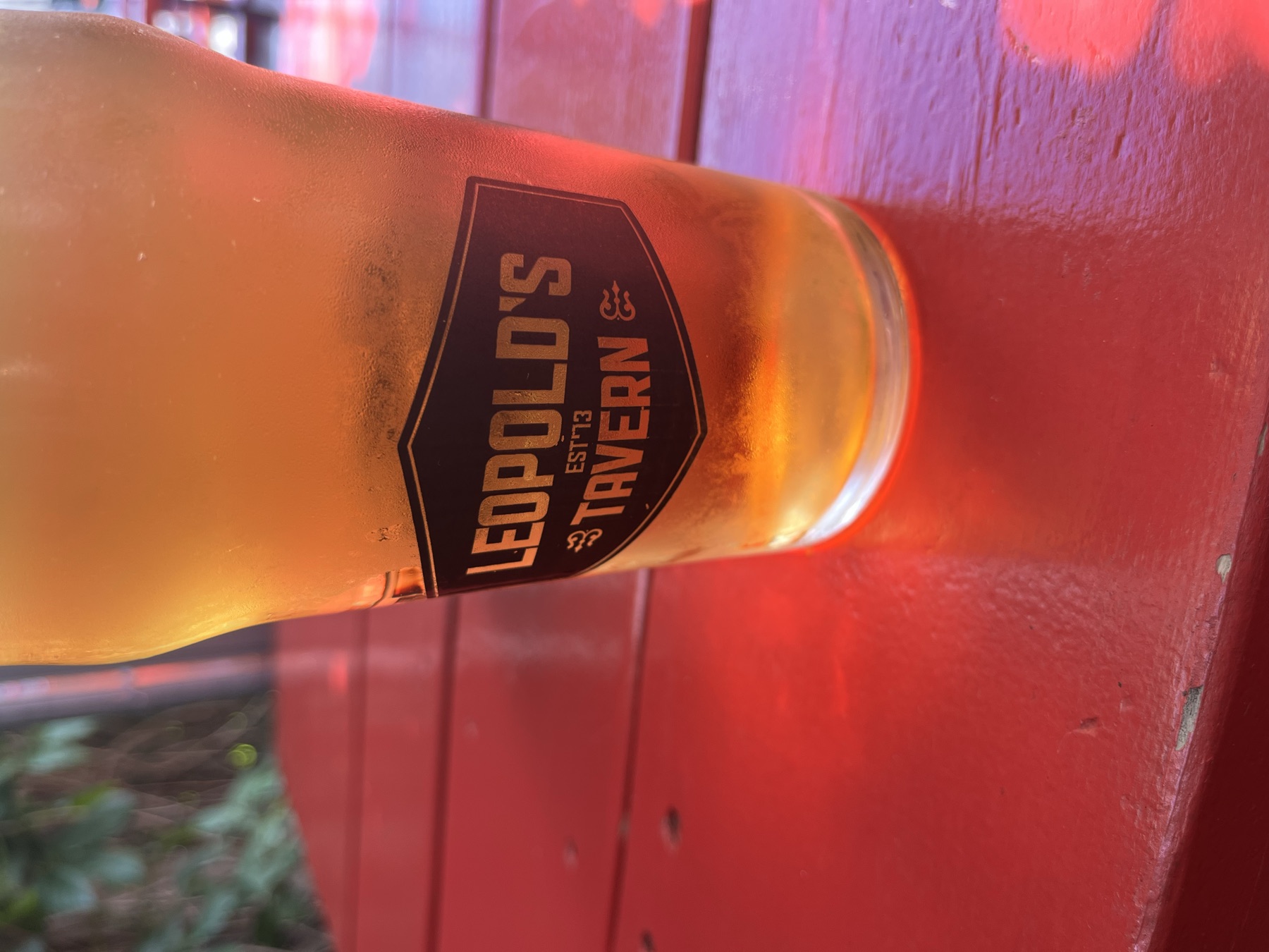 A glass of beer on a red table at Leopold's Tavern