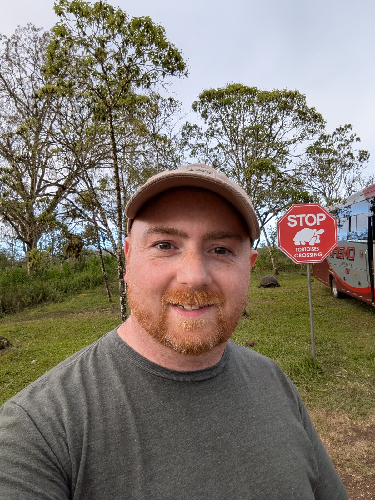 Shaun stopping beside a tortoise crossing sign while travelling
