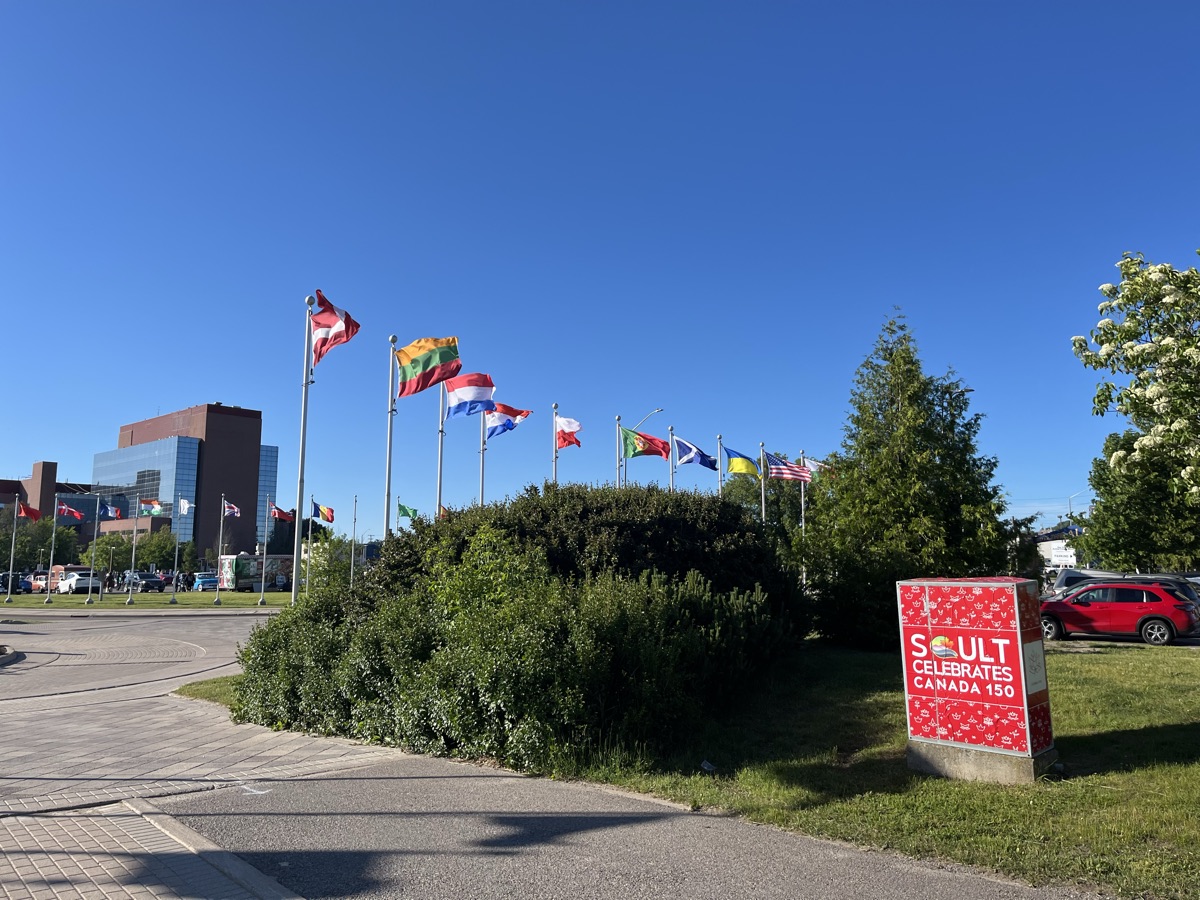 International flags flying beside the park in Sault Ste. Marie