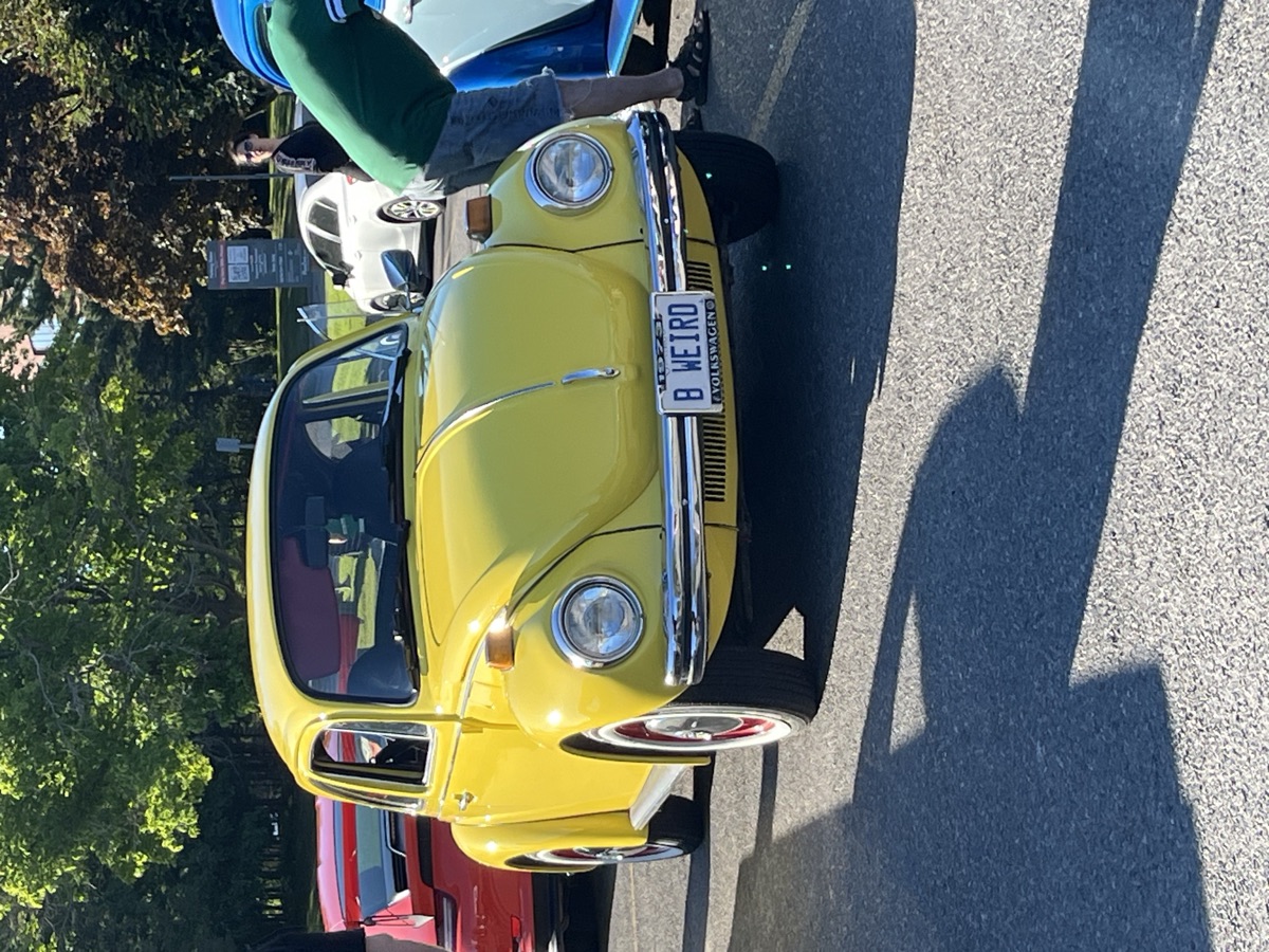 A yellow classic Volkswagen Beetle at the Sault Ste. Marie car event