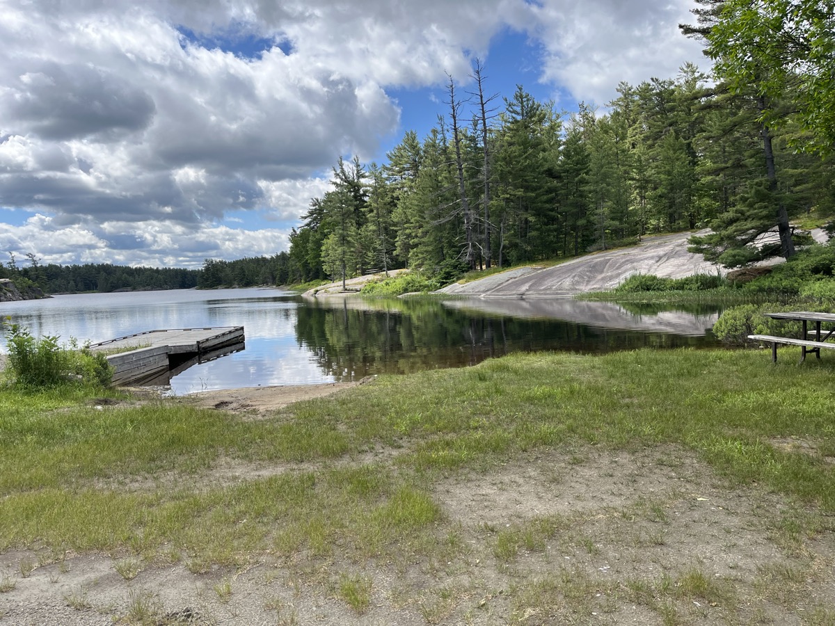 A calm lake surrounded by forest at Grundy Lake Provincial Park