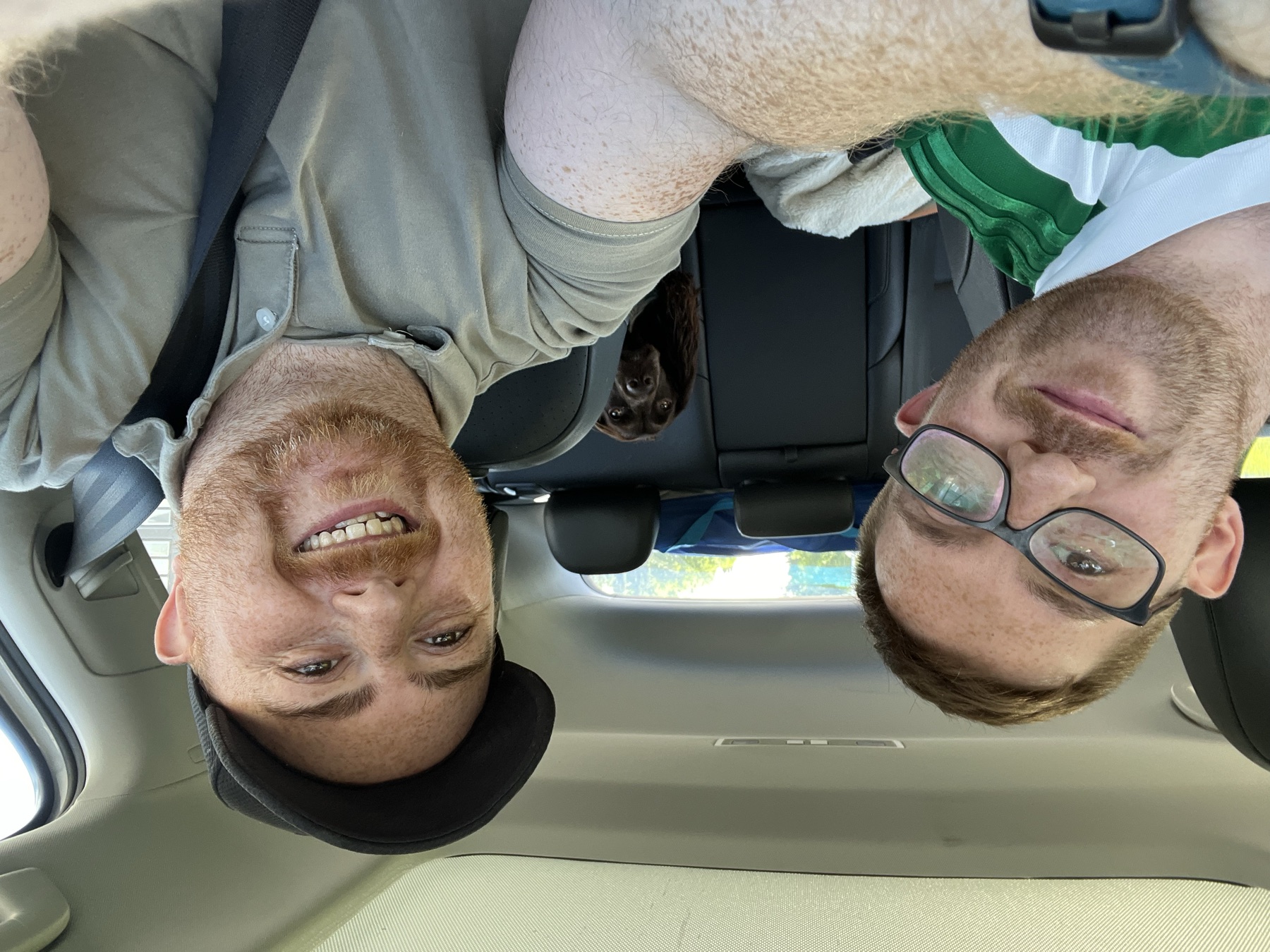 My brother and me in the front seats with Tilly peeking between us