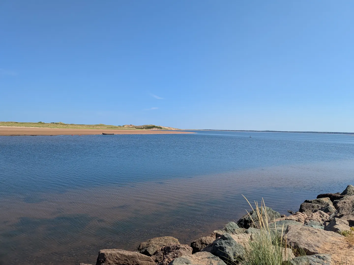 Blue water and dunes at Tracadie Beach